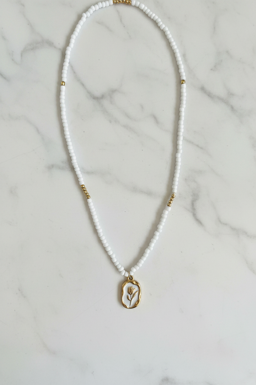 Beaded Tulip Necklace on marble background