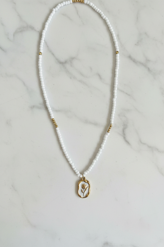 Beaded Tulip Necklace on marble background